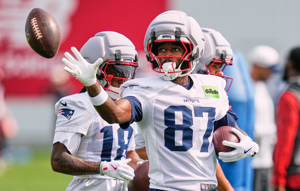 New England Patriots wide receiver Romeo Doubs grabs a pass during an NFL football practice, Wednesday, Sept. 16, 2026, in Foxborough, Mass. (AP Photo/Charles Krupa)