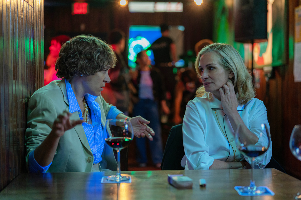 This image released by Amazon MGM Studios shows Chloë Sevigny, left, and Julia Roberts in a scene from "After the Hunt." (Yannis Drakoulidis/Amazon MGM Studios via AP)