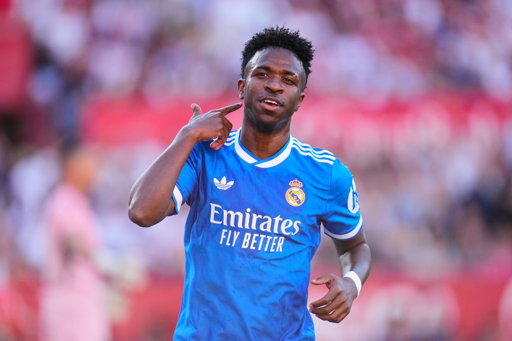 Real Madrid's Vinicius Junior celebrates after scoring the opening goal during the Spanish La Liga soccer match between Real Madrid and Sevilla in Seville, Spain, Sunday, May 17, 2026. (AP Photo/Jose Breton)