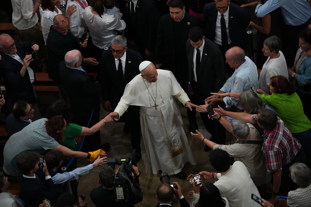 Pope Leo XIV leaves at the end of a meeting with faithful and members of the diocesan charity and welfare organizations in the Church of Sant Agusti in Barcelona, Spain, Wednesday, June 10, 2026 (AP Photo/Alessandra Tarantino)