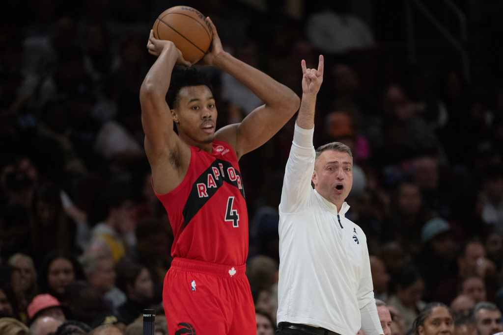 Toronto Raptors' Scottie Barnes (4) prepares to inbound the ball as head coach Darko Rajakovic, right, calls directions during the second half of an NBA basketball game against the Cleveland Cavaliers in Cleveland, Thursday, Nov. 13, 2025. (AP Photo/Phil Long)