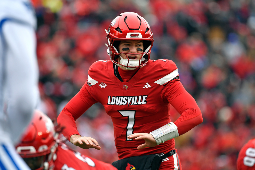 Louisville quarterback Miller Moss (7) calls a play during the first half of an NCAA college football game against Kentucky, Louisville, Ky., Saturday, Nov. 29, 2025. (AP Photo/Timothy D. Easley)