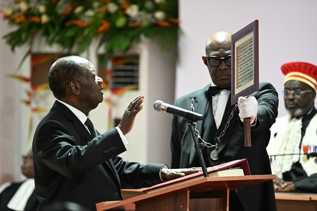 Ivory Coast President Alassane Ouattara is sworn in at the Presidential Palace in Abidjan, Ivory Coast, Monday, Dec. 8, 2025. (Sia Kambou/Pool Photo via AP)