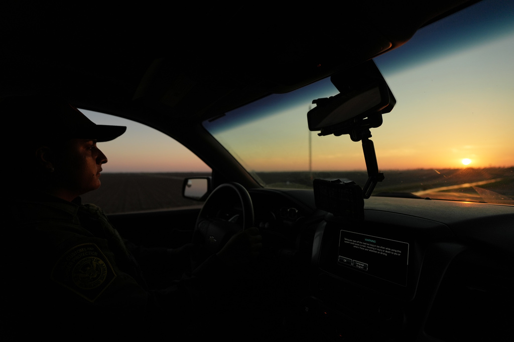A U.S. Border Patrol agent drives along a new section of border wall at the Santa Ana Wildlife Refuge in Alamo, Texas, Tuesday, Aug. 25, 2026. (AP Photo/Eric Gay)