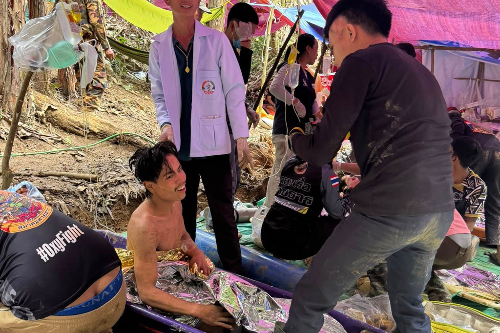 This image provided by the Association Of Volunteers For Lao People, shows rescuers after they safely evacuated the villagers, who had been trapped in a cave in Xaisomboun province, Laos, Saturday, May 30 , 2026. (Association Of Volunteers For Lao People via AP)