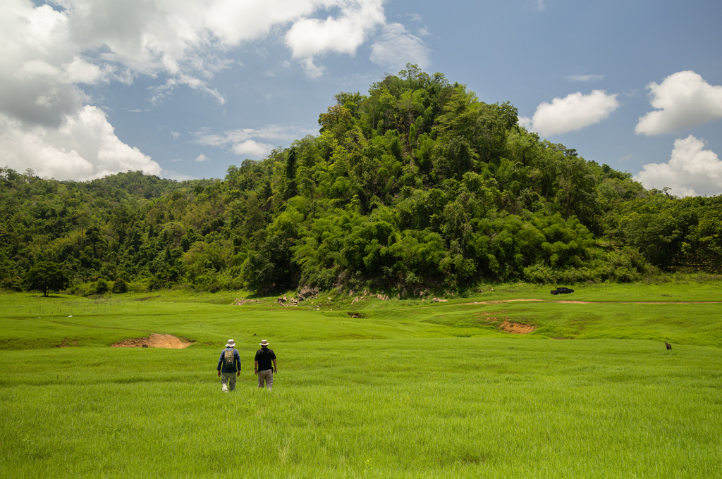 Researchers walk into the empty reservoir where Nithe Station, a depot on World War II's infamous "Death Railway" resurfaced after the reservoir was drained in Sangkhlaburi, Thailand on Saturday, May 30, 2026. (AP Photo/Anton L. Delgado)