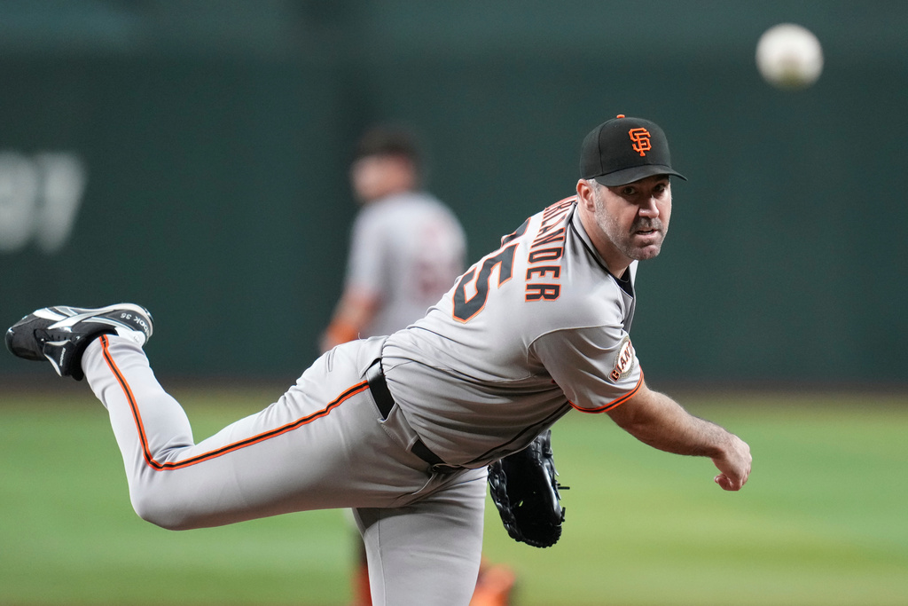 FILE - San Francisco Giants starting pitcher Justin Verlander warms up during the first inning of a baseball game against the Arizona Diamondbacks Wednesday, Sept. 17, 2025, in Phoenix. (AP Photo/Ross D. Franklin, File)