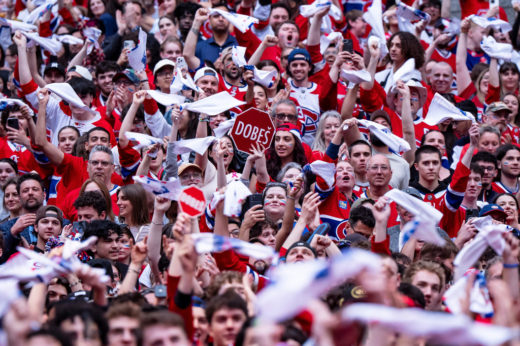 Fans cheer on the Montreal Canadiens ahead of NHL playoff hockey game against the Carolina Hurricanes in Montreal on Wednesday, May 27, 2026. (Christopher Katsarov/The Canadian Press via AP)