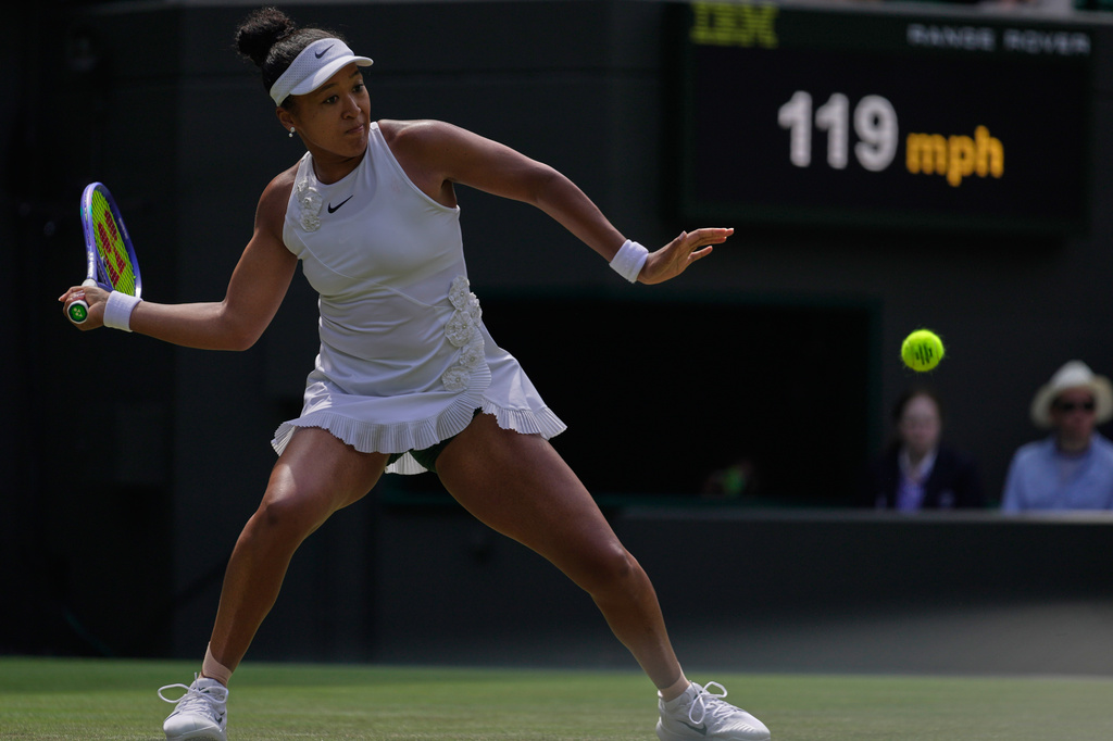 Naomi Osaka of Japan plays a return during the third round women's singles match against Daria Kasatkina of Australia at the Wimbledon Tennis Championships in London, Friday, July 3, 2026.(AP Photo/Brian Inganga)
