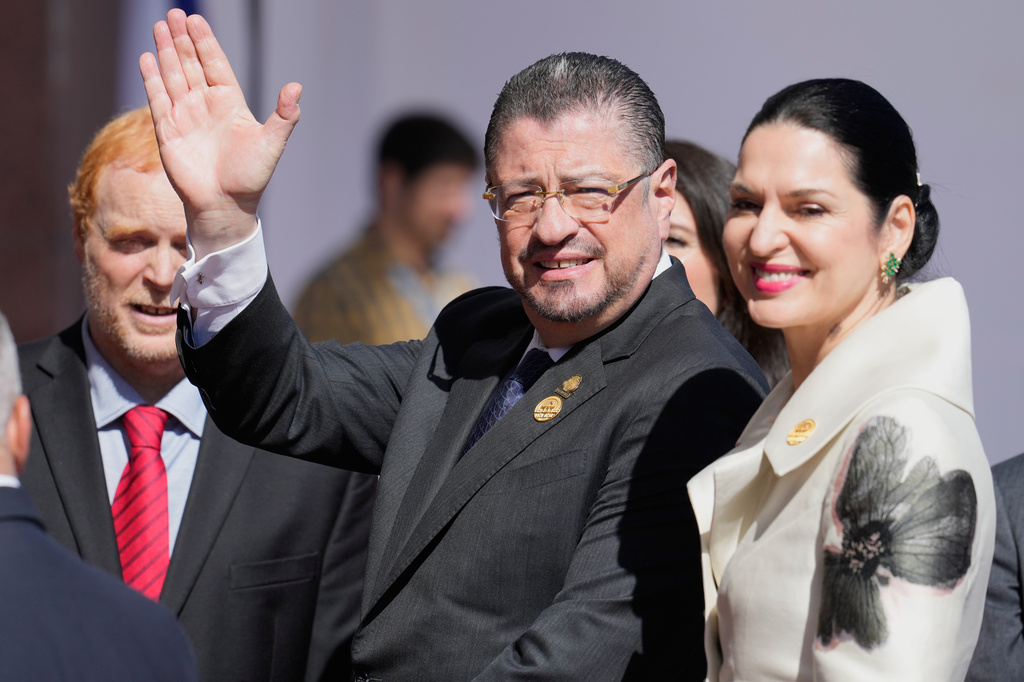 FILE - Costa Rica President Rodrigo Chaves, accompanied by his wife Signe Zeicate, waves as he arrives for the inauguration ceremony of Chile's new president, in Valparaiso, March 11, 2026. (AP Photo/Gustavo Garello, File)