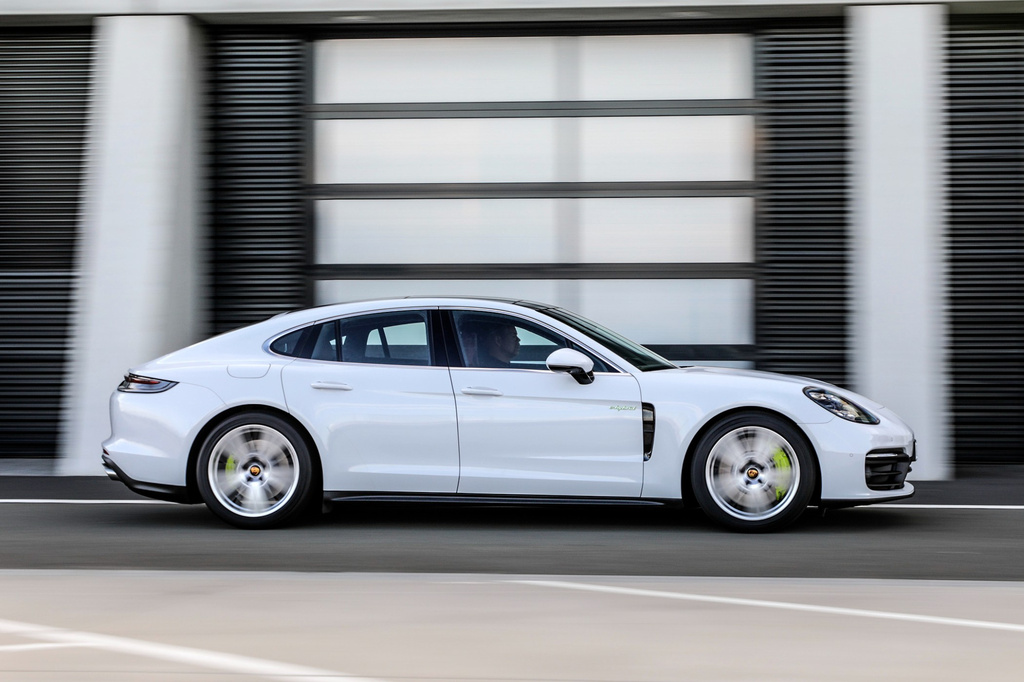 This photo provided by Porsche shows a 2020 Panamera. A plug-in hybrid version of a Panamera has less than 20 miles of all-electric range but fully delivers all of the refinement you expect of a premium luxury sedan. (Courtesy of Porsche Cars North America via AP)