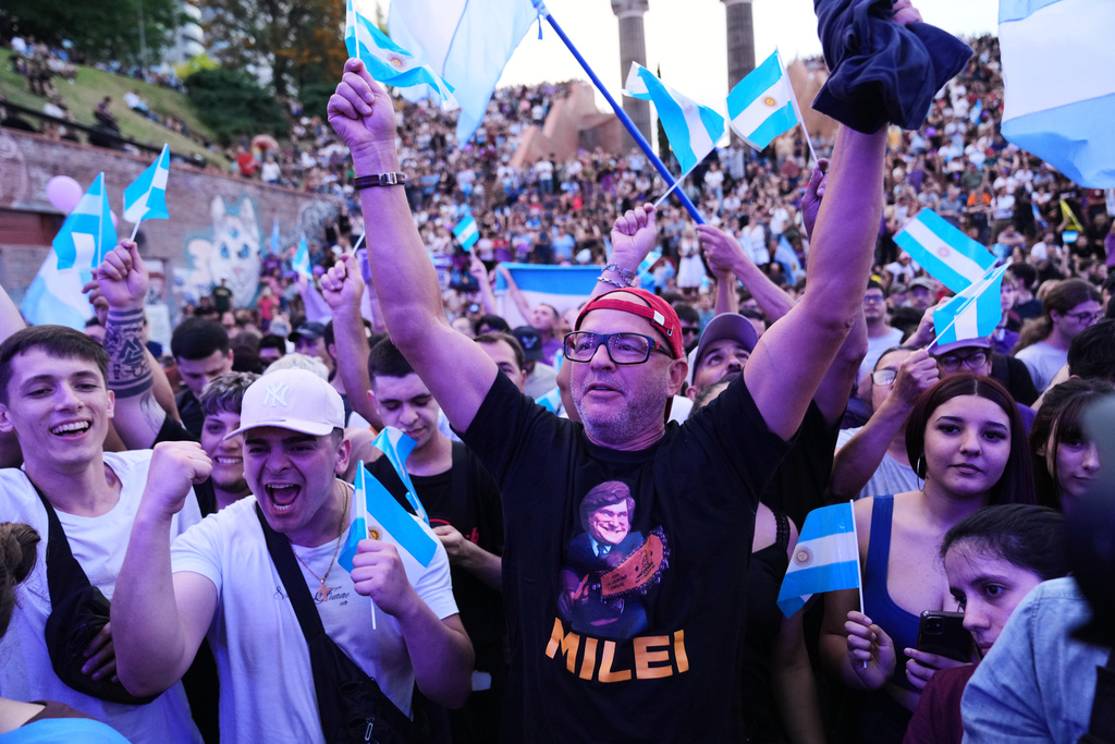 Supporters of President Javier Milei cheer during a rally in support of his party's candidates ahead of the upcoming midterm elections, in Rosario, Argentina, Thursday, Oct. 23, 2025. (AP Photo/Rodrigo Abd)