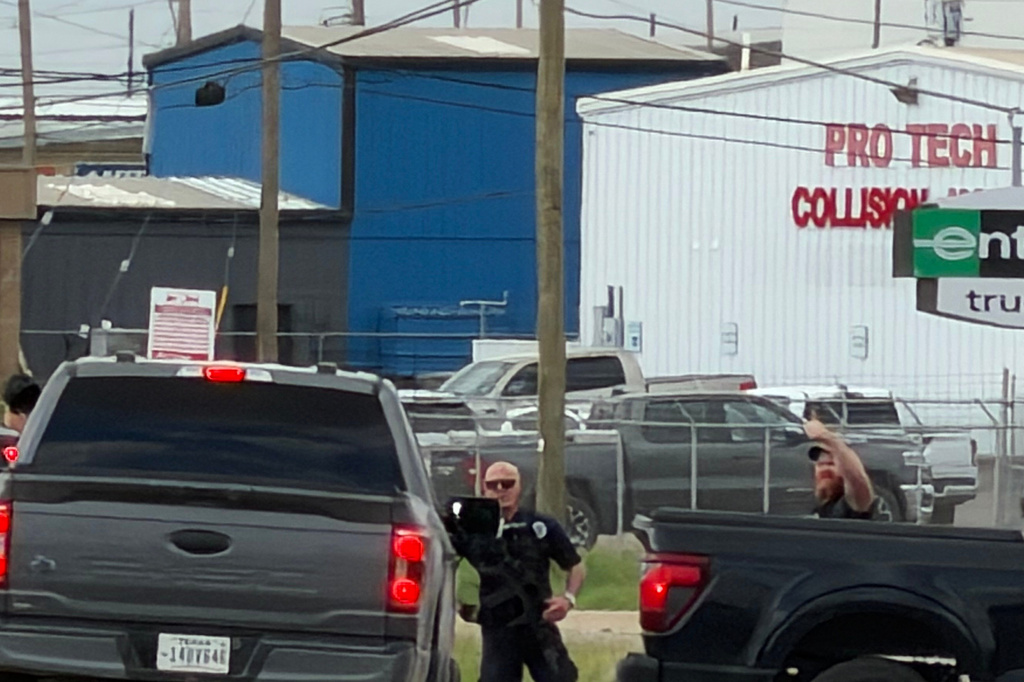 Law enforcement responds to an active shooting scene Friday, June 12, 2026, in Midland, Texas. (Luke Dias/Reporter-Telegram via AP)