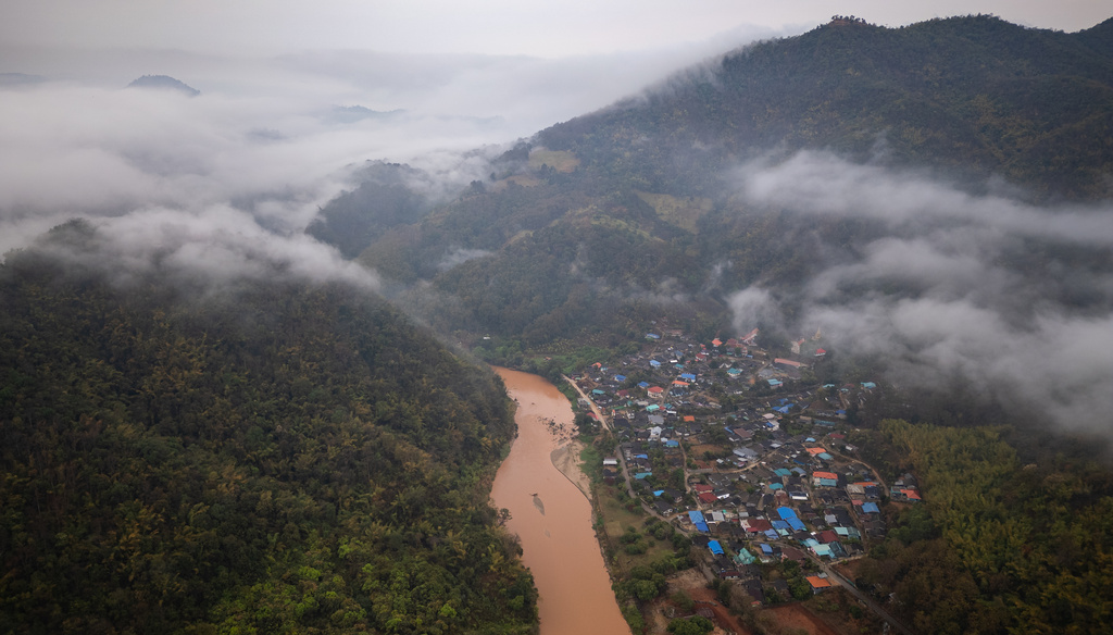 Mist covers the Thai village of Tha Ton, where the Kok River enters Thailand from Myanmar, on Feb. 20, 2026. (AP Photo/Anton L. Delgado)