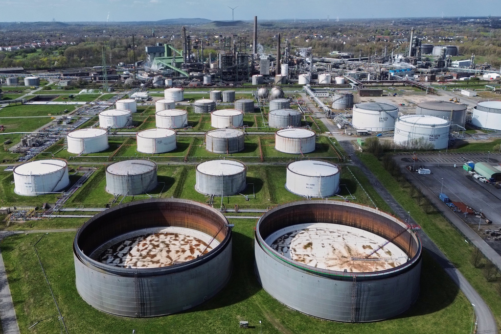 Empty oil tanks are seen at a big BP refinery in Gelsenkirchen, Germany, Wednesday, April 1, 2026. (AP Photo/Martin Meissner)