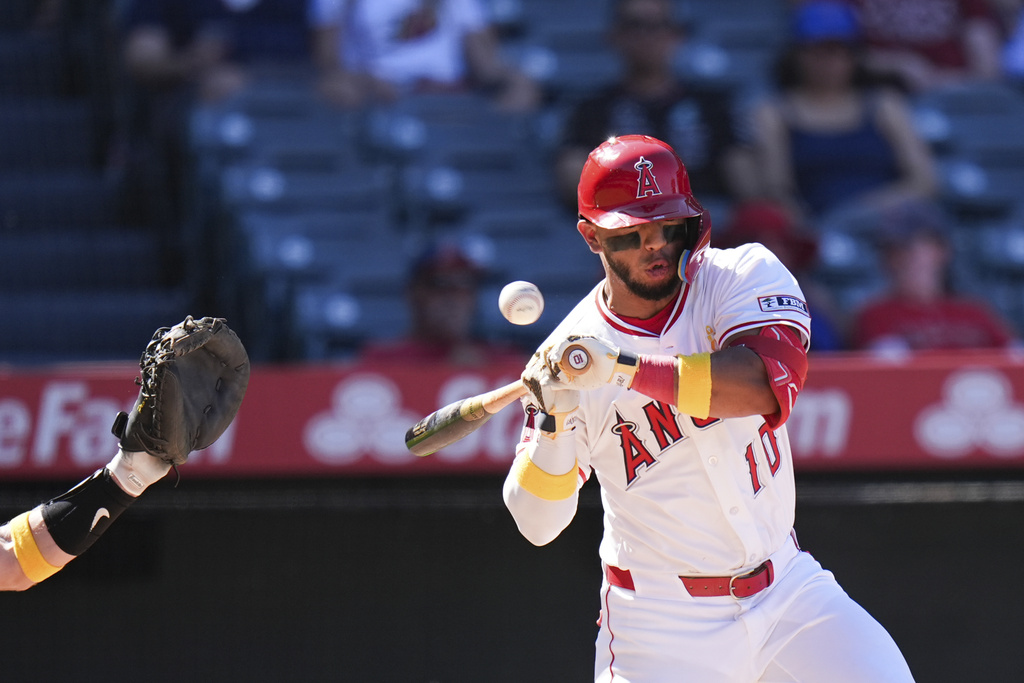 Los Angeles Angels' Oswald Peraza (10) is hit by a pitch during the eighth inning of a baseball game against the Athletics Sunday, Sept. 7, 2025, in Anaheim, Calif. (AP Photo/Jae C. Hong)