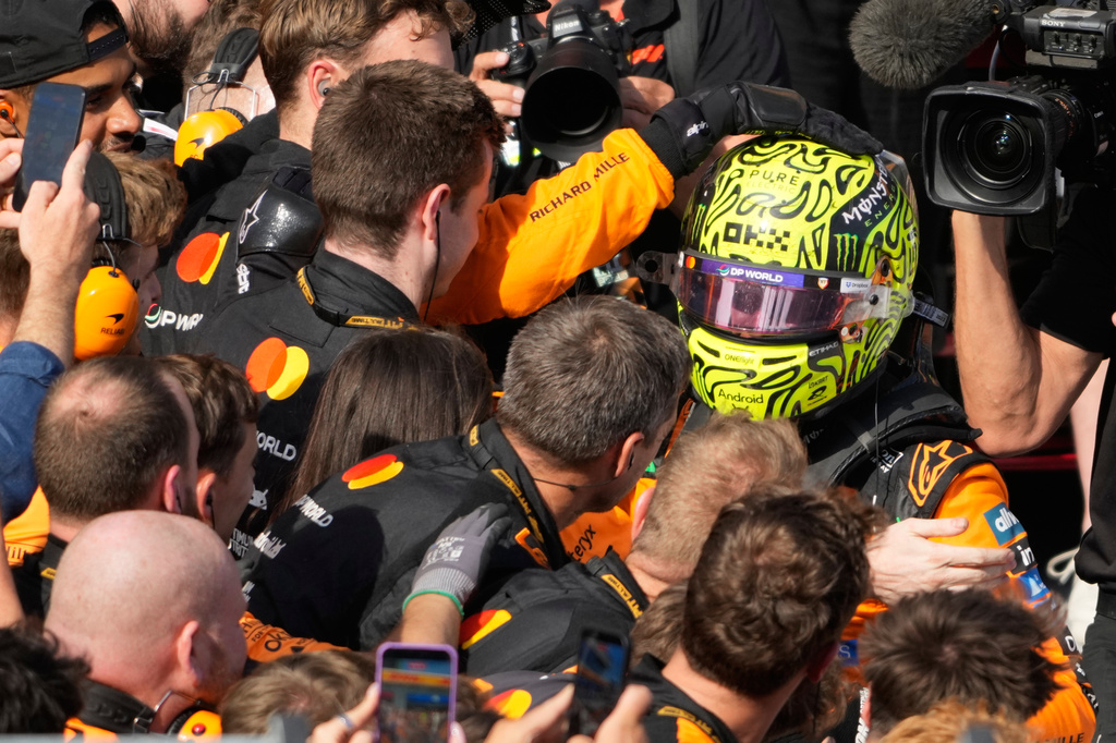 McLaren driver Lando Norris of Britain celebrates after winning the Formula One Hungarian Grand Prix auto race, at the Hungaroring racetrack in Mogyorod, near Budapest, Hungary, Sunday, July 26, 2026. (AP Photo/Darko Bandic)