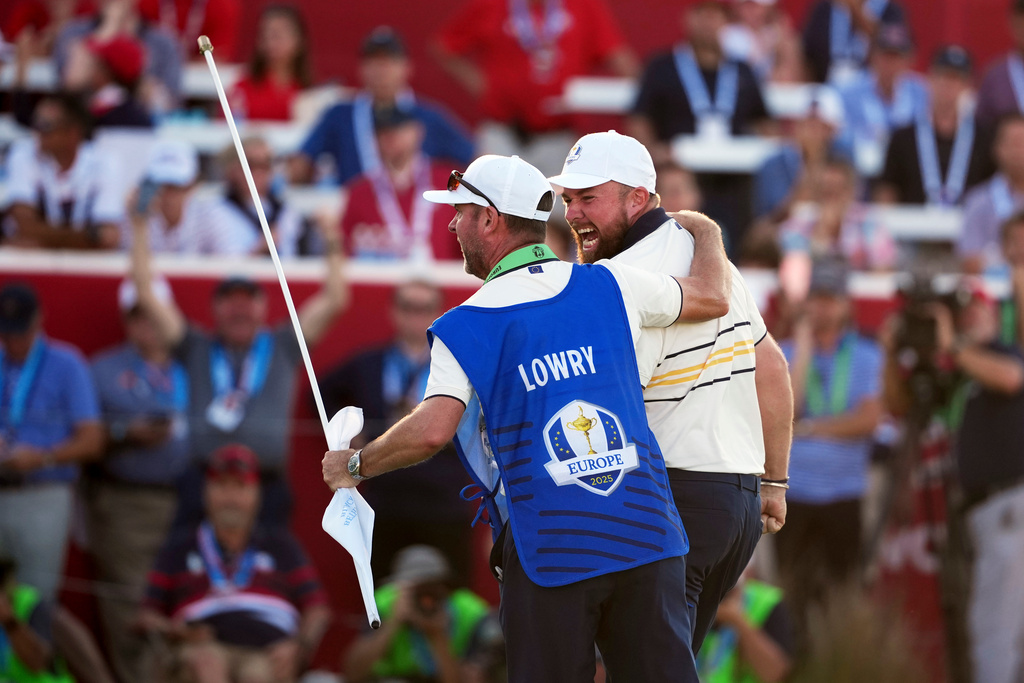 Europe's Shane Lowry celebrates after making the winning putt putt on the 18th hole during their singles match on the Bethpage Black golf course at the Ryder Cup golf tournament, Sunday, Sept. 28, 2025, in Farmingdale, N.Y. (AP Photo/Matt Slocum)