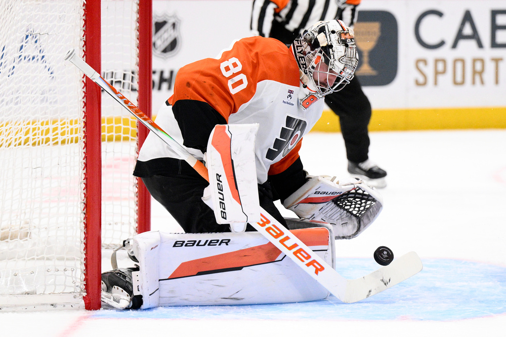 Philadelphia Flyers goaltender Dan Vladar stops the puck during the second period of an NHL hockey game against the Washington Capitals, Wednesday, Feb. 25, 2026, in Washington. (AP Photo/Nick Wass)
