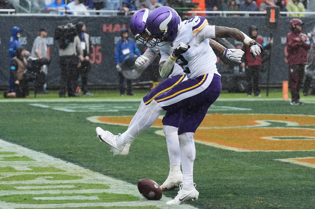 Minnesota Vikings cornerback Isaiah Rodgers, right, celebrates after recovering a fumble by the Chicago Bears during the second half of an NFL football game in Chicago, Sunday, Sept. 20, 2026. (AP Photo/David Banks)