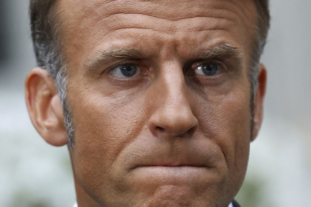 French President Emmanuel Macron speaks with the media after a meeting with U.S. President Donald Trump, Ukrainian President Volodymyr Zelenskyy and European leaders, amid negotiations to end the Russian war in Ukraine, at the French Embassy in Washington, D.C., U.S., Monday, Aug. 18, 2025. (Yves Herman/Pool via AP)