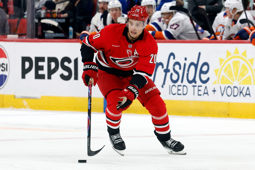 Carolina Hurricanes' Sebastian Aho (20) brings the puck up the ice against the New York Islanders during the second period of an NHL hockey game in Raleigh, N.C., Thursday, Oct. 30, 2025. (AP Photo/Karl DeBlaker)