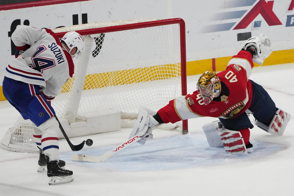 Montréal Canadiens center Nick Suzuki (14) scores the game winning goal against Florida Panthers goaltender Daniil Tarasov (40) during overtime in an NHL hockey game, Tuesday, Dec. 30, 2025, in Sunrise, Fla. (AP Photo/Lynne Sladky)