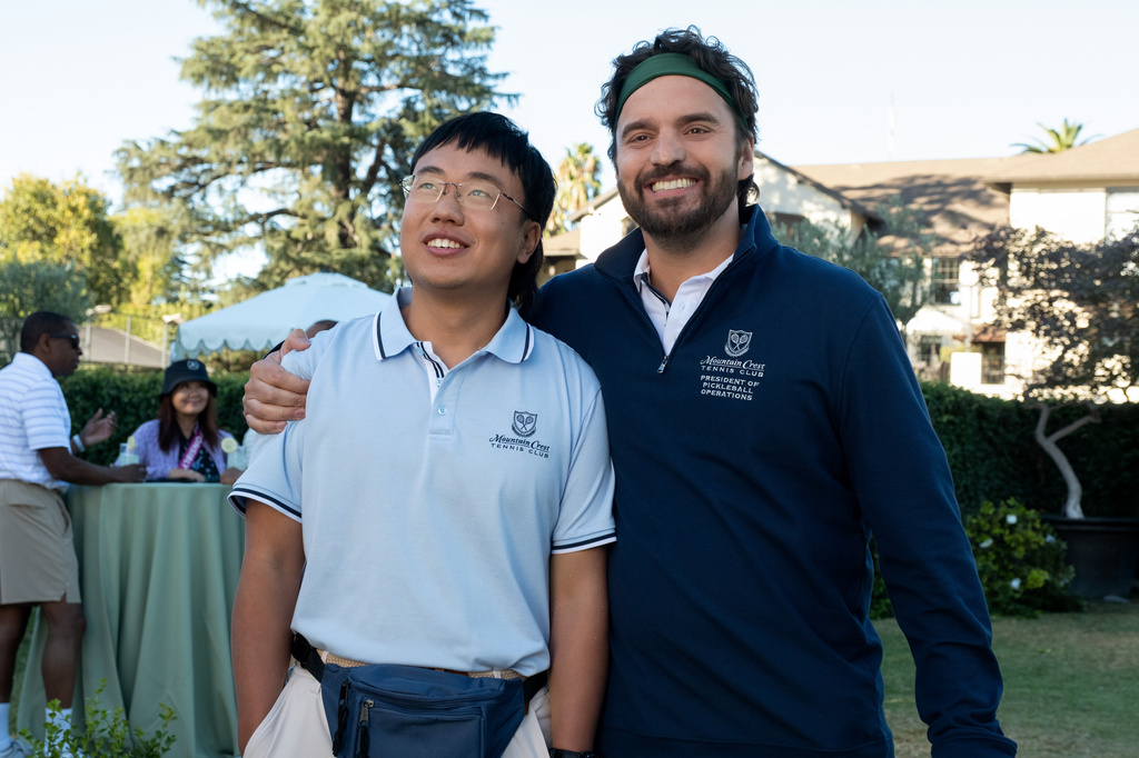 This image released by Apple TV shows Aaron Chen, left, and Jake Johnson in a scene from "The DInk." (Andrew Cooper/Apple TV via AP)