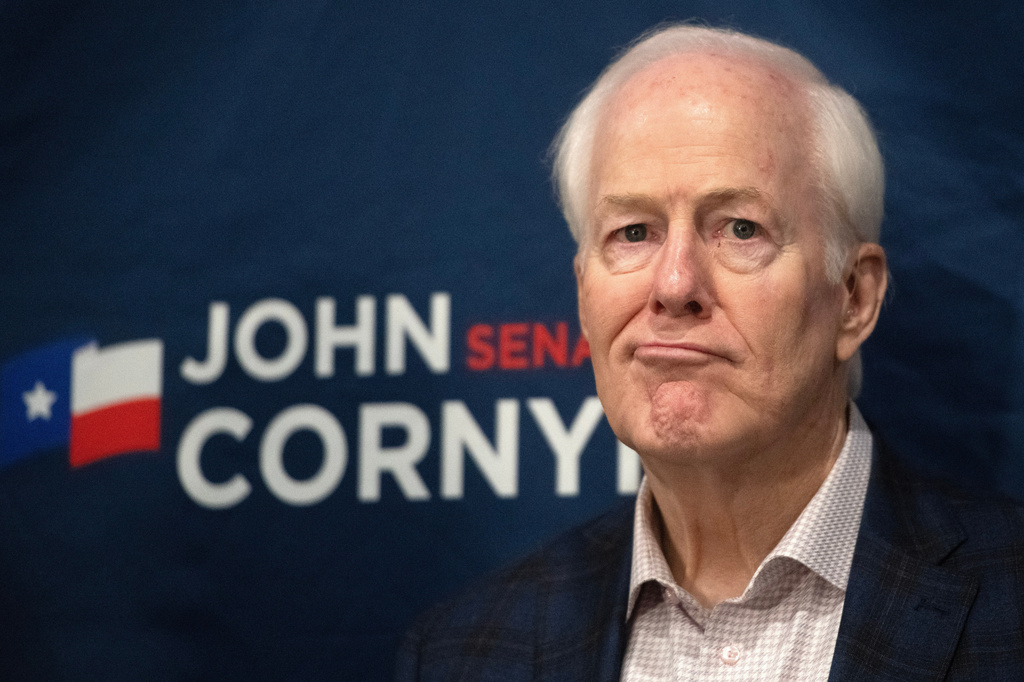 Sen. John Cornyn, R-Texas, listens to State Sen. Charles Perry, R-Lubbock, during a campaign event in Lubbock, Texas, Tuesday, May 19, 2026. (AP Photo/Annie Rice)