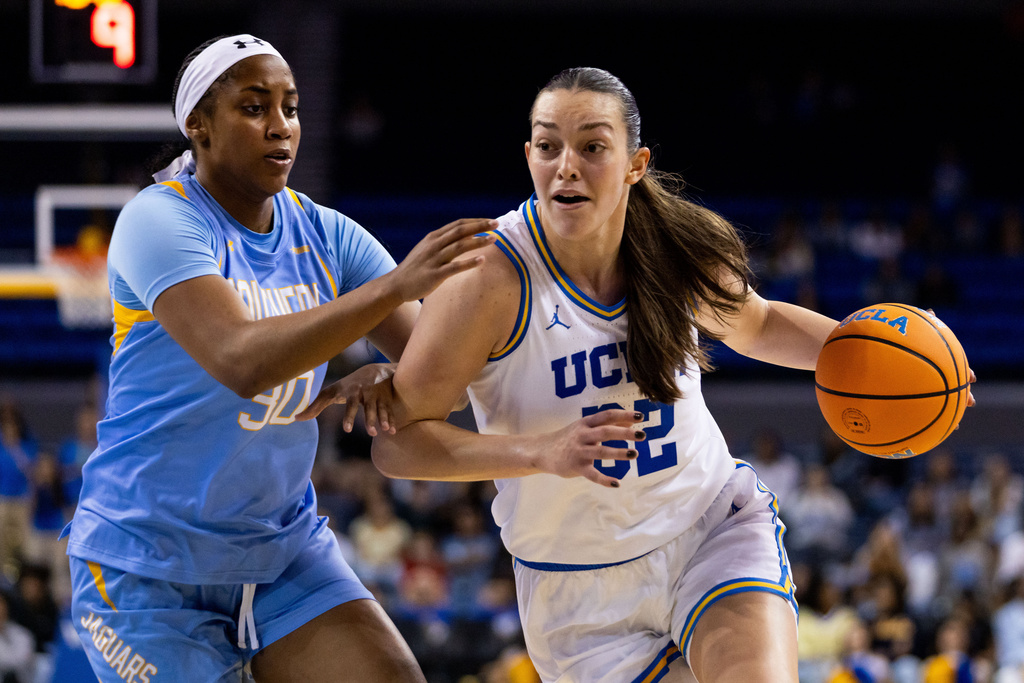 UCLA forward Angela Dugalić drives the ball against Southern during the second half of an NCAA college basketball game, Sunday, Nov. 23, 2025, in Los Angeles. (AP Photo/Ethan Swope)