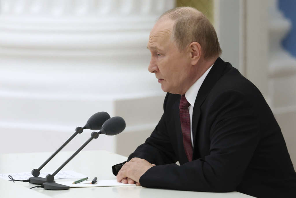 Russian President Vladimir Putin speaks during a working meeting to discuss the results of the Russia-US summit in Alaska at the Kremlin in Moscow, Russia, on Saturday, Aug. 16, 2025. (Vyacheslav Prokofyev, Sputnik, Kremlin Pool Photo via AP)