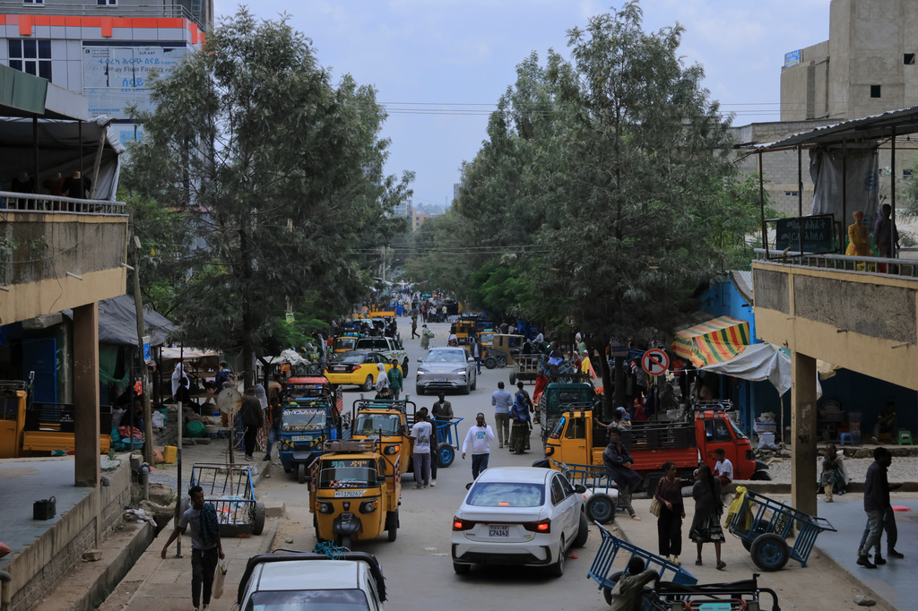 People walk in Mekelle, the capital of Ethiopia's Tigray region, as fighting escalates with the central government, Thursday, Sept. 24, 2026. (AP Photo)