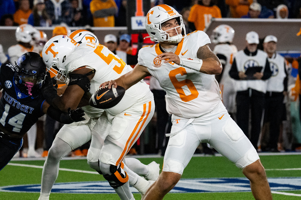 Tennessee quarterback Joey Aguilar (6) drops back for a pass in the second quarter of an NCAA college football game against Kentucky, Saturday, Oct. 25, 2025, in Lexington, Ky. (AP Photo/Michael Swensen)