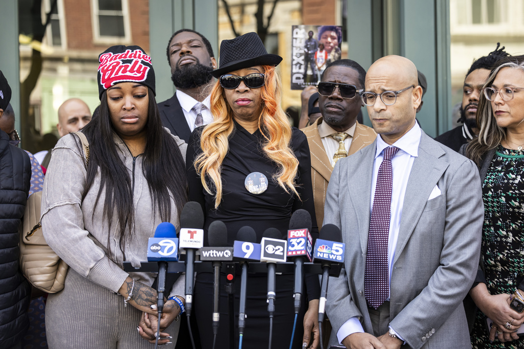 FILE - Flanked by family members, attorneys and supporters, Dexter Reed's mother, Nicole Banks, speaks to reporters outside the headquarters for the Civilian Office of Police Accountability in West Town, Chicago, Tuesday, April 9, 2024. Reed, 26, was shot to death March 21 during a traffic stop by Chicago police. (Ashlee Rezin/Chicago Sun-Times via AP)