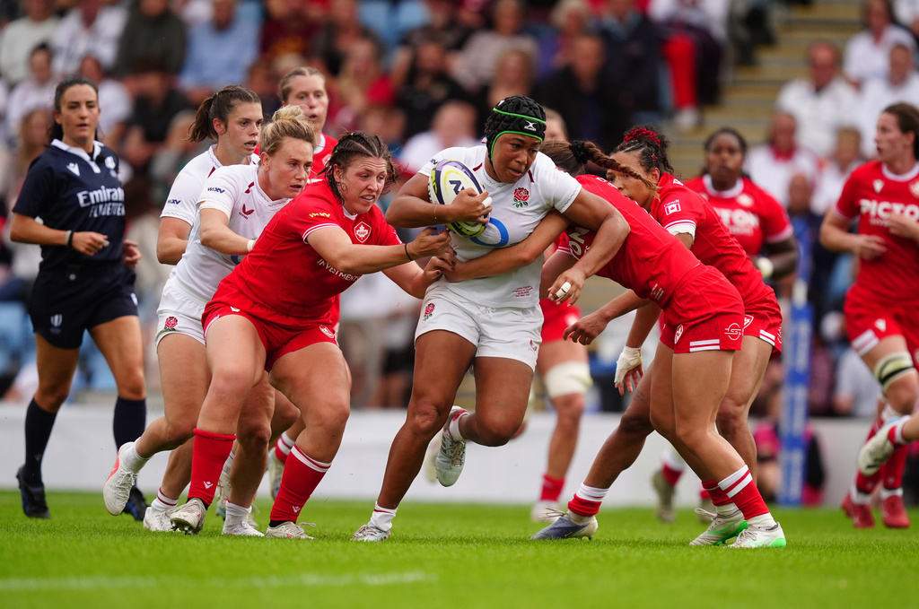 England's Sadia Kabeya is tackled by Canada's Taylor Perry during the WXV Global Series match between England and Canada in Exeter, England, Saturday Sept. 19, 2026. (David Davies/PA via AP)