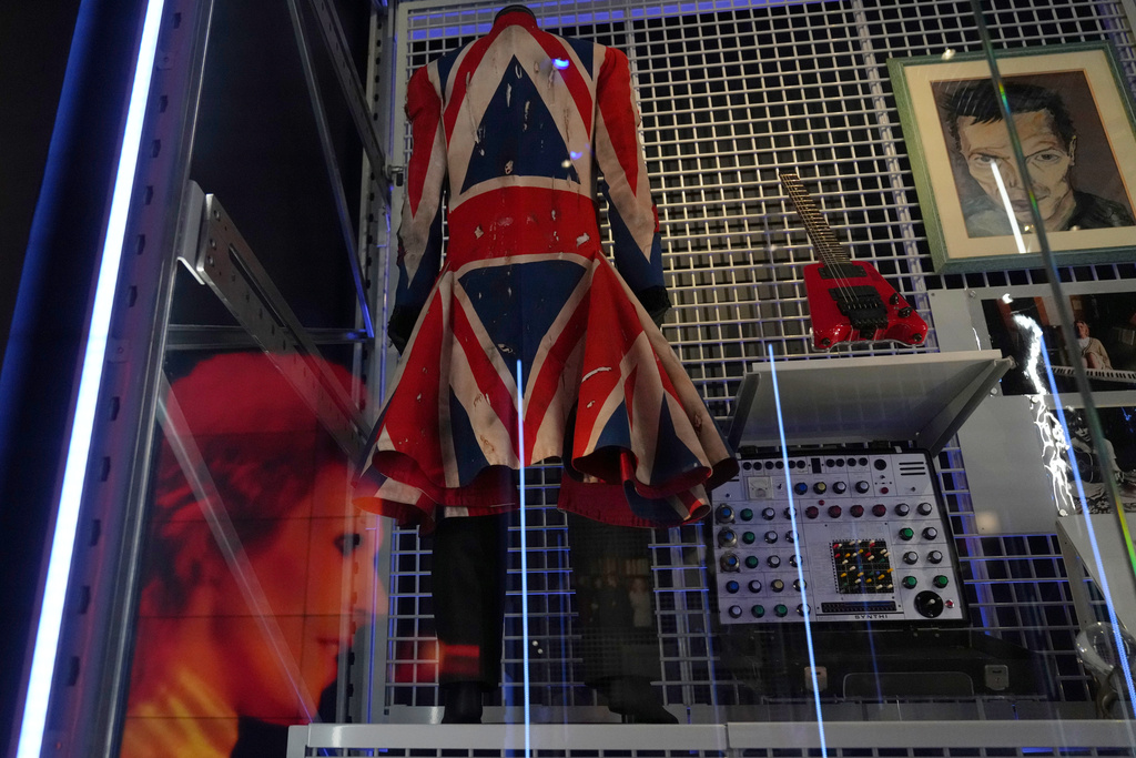 Earthling, a Union Flag frock coat designed by David Bowie and Alexander McQueen in 1997, is on display during a press preview of the David Bowie Centre, a new archive at the V&A East Storehouse in London, Wednesday, Sept. 10, 2025, ahead of its public opening on Saturday. (AP Photo/Joanna Chan)