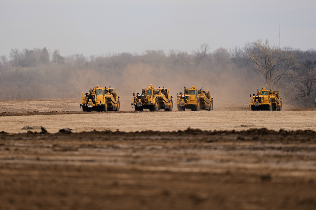 FILE - Earth movers prepare a site for a 2.5 million square foot AI data center March 24, 2026, in Independence, Mo. (AP Photo/Charlie Riedel, File)
