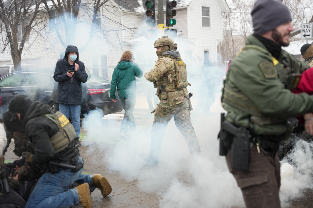 FILE - Tear gas is deployed as federal agents make arrests, Jan. 21, 2026, in Minneapolis. (AP Photo/Angelina Katsanis, File)
