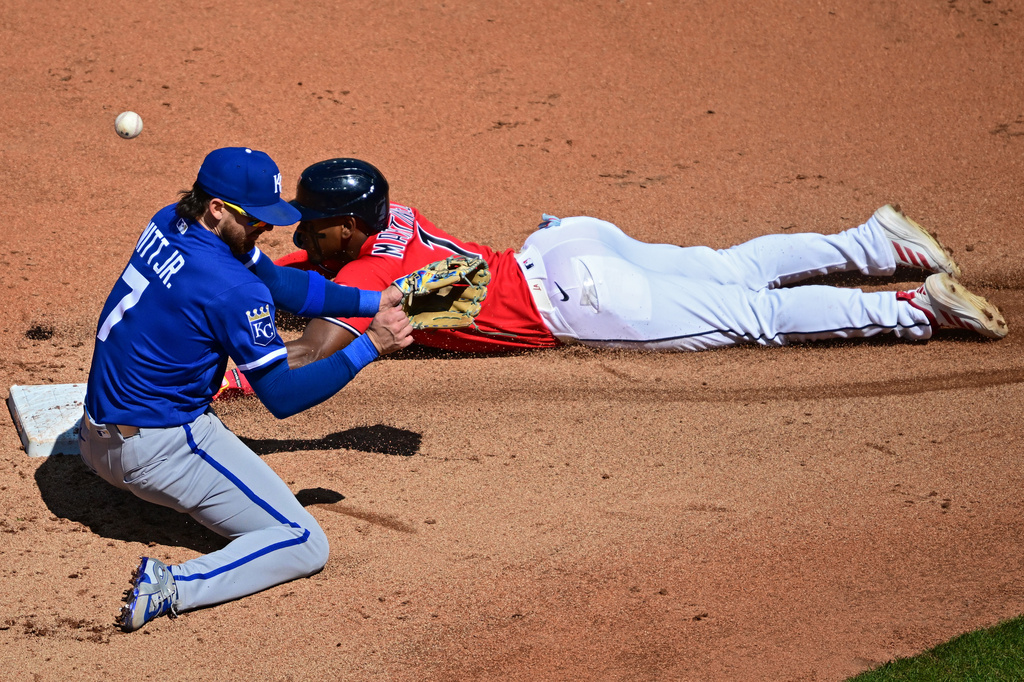 Cleveland Guardians' Angel Martinez steals second base as Kansas City Royals shortstop Bobby Witt Jr. misplays the ball during the fourth inning of a baseball game, Wednesday, April 8, 2026, in Cleveland. (AP Photo/David Dermer)