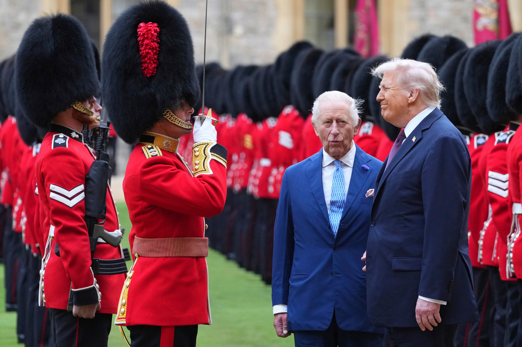 FILE - President Donald Trump and Britain's King Charles III review the Guard of Honour after the arrival at Windsor Castle in Windsor, England, Wednesday, Sept. 17, 2025.(AP Photo/Kirsty Wigglesworth, Pool, File)