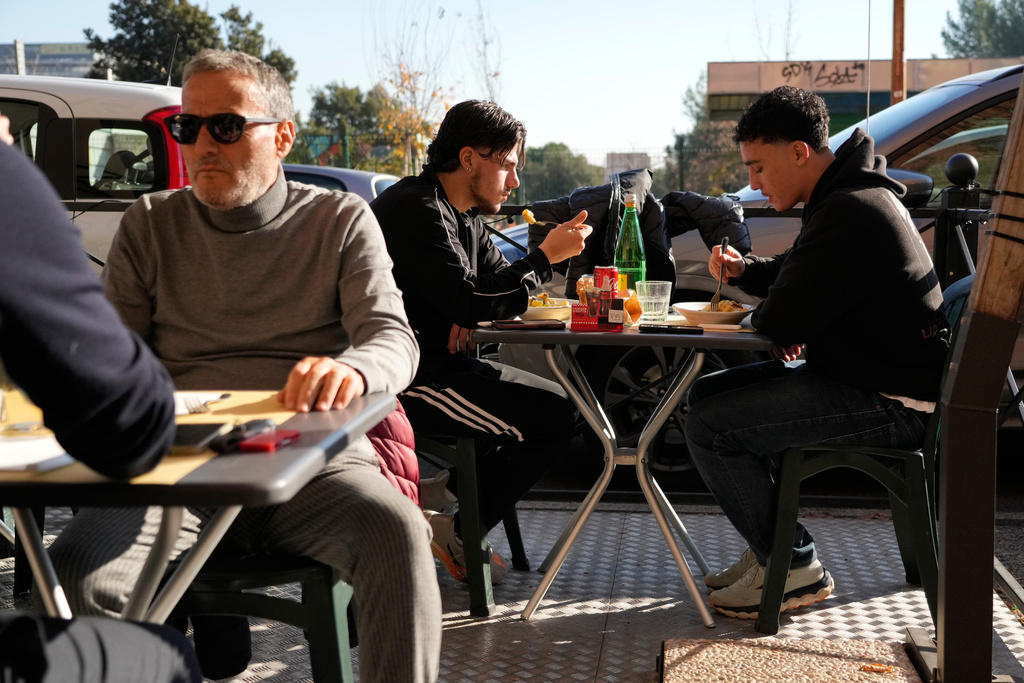 Customers enjoy their pasta at a restaurant in Rome, Wednesday, Dec. 10, 2025. (AP Photo/Gregorio Borgia)