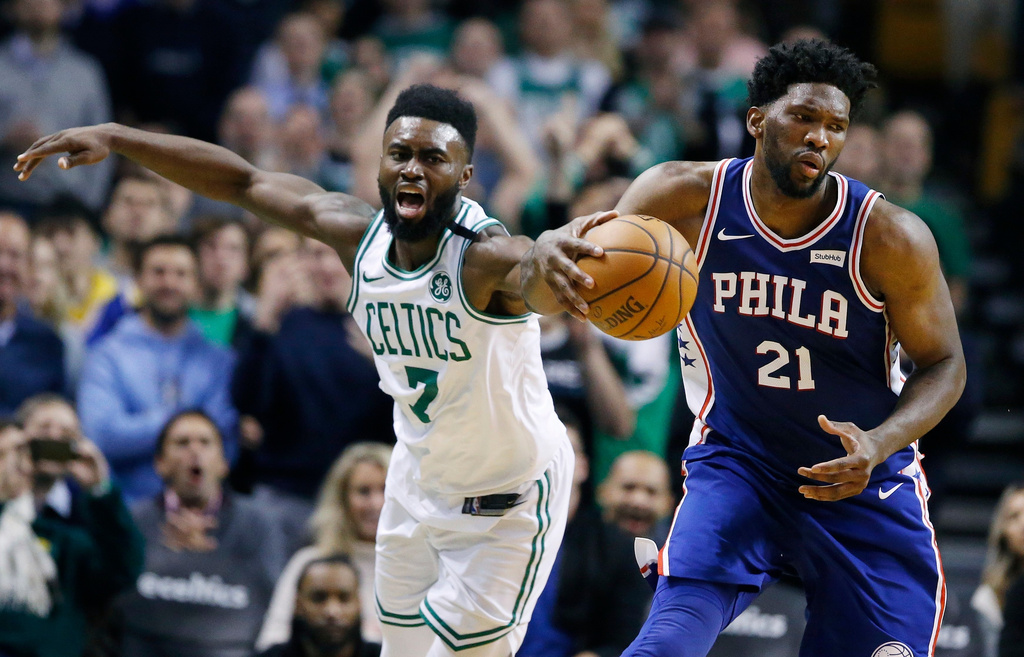 FILE - Philadelphia 76ers' Joel Embiid (21) beats Boston Celtics' Jaylen Brown (7) to the ball during the fourth quarter of an NBA basketball game in Boston, Thursday, Jan. 18, 2018. (AP Photo/Michael Dwyer,File)