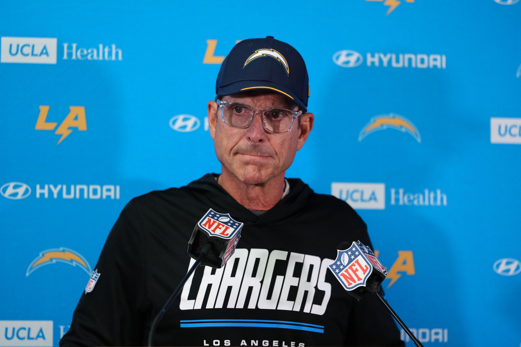 Los Angeles Chargers head coach Jim Harbaugh listens to a question during a news conference after an NFL football game against the Kansas City Chiefs in Kansas City, Mo., Sunday, Oct. 18, 2026. (AP Photo/Ed Zurga)