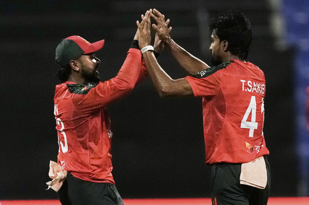 Bangladesh's players celebrates the dismissal of Hong Kong's Babar Hayat during the Asia Cup Cricket match between Bangladesh and Hong Kong at Zayed Cricket Stadium in Abu Dhabi, United Arab Emirates, Thursday, Sept. 11, 2025. (AP Photo/Fatima Shbair)