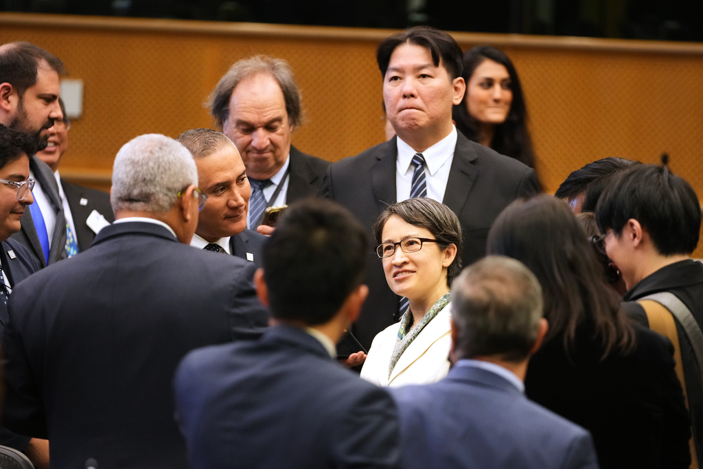 Taiwan's Vice President Bi-Khim Hsiao, center, speaks with attendees after addressing at the European Parliament in Brussels, Friday, Nov. 7, 2025. (AP Photo/Virginia Mayo)