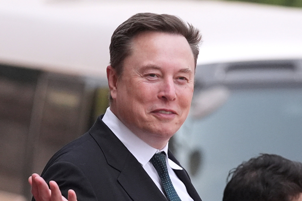 FILE - Elon Musk departs after a welcome ceremony with President Donald Trump and China's President Xi Jinping at the Great Hall of the People, May 14, 2026, in Beijing. (AP Photo/Mark Schiefelbein, File)