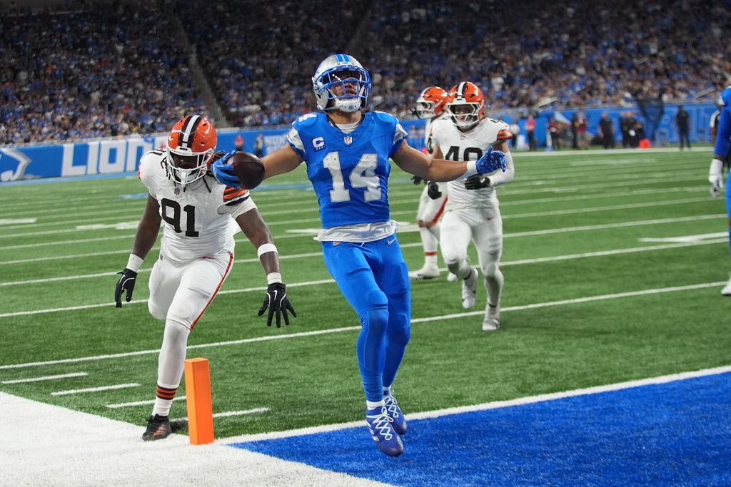 Detroit Lions wide receiver Amon-Ra St. Brown (14) reacts after a touchdown during the second half of an NFL football game against the Cleveland Browns, Sunday, Sept. 28, 2025, in Detroit. (AP Photo/Paul Sancya)
