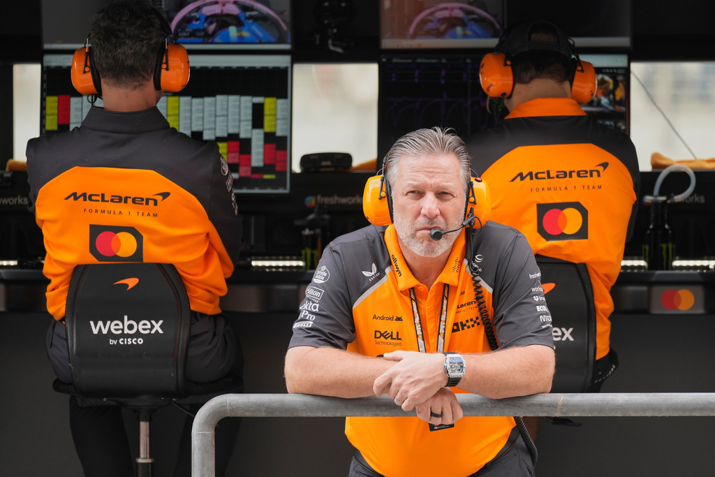 McLaren chief Zak Brown listens to radio during a first practice for the he Abu Dhabi Formula One Grand Prix in Abu Dhabi, United Arab Emirates, Friday, Dec. 5, 2025. (AP Photo/Darko Bandic)