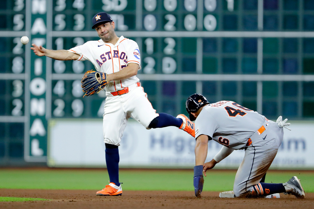 Detroit Tigers' Wenceel Perez, right, is out at second base as Houston Astros second baseman Jose Altuve, left, attempts a double play during the fifth inning of a baseball game, Tuesday, June 16, 2026, in Houston. (AP Photo/Michael Wyke)