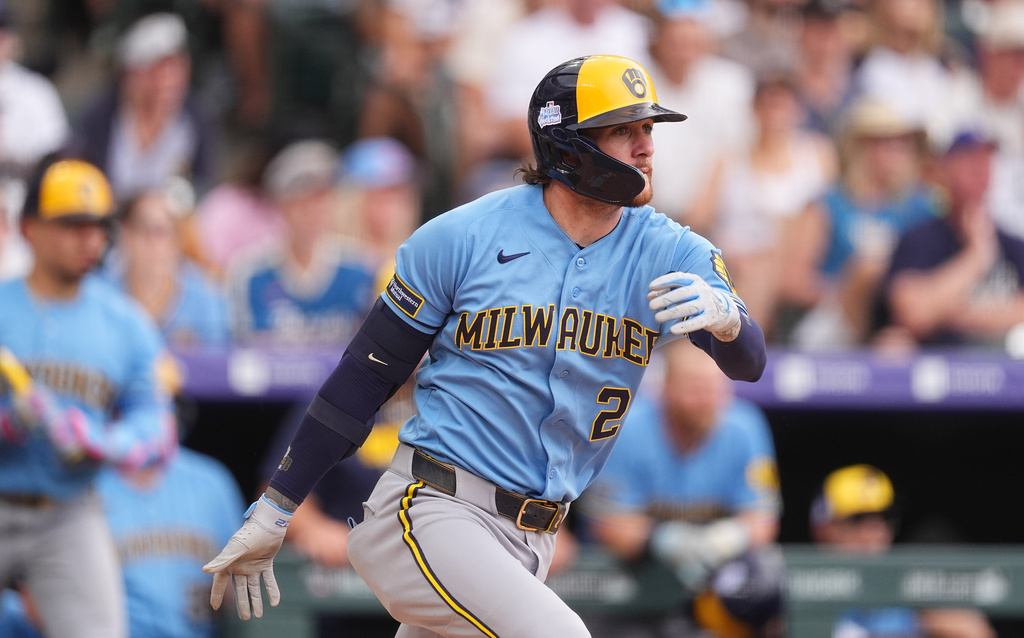 Milwaukee Brewers' Brice Turang breaks from the batter's box after connecting for a single to drive in two runs off Colorado Rockies relief pitcher Jaden Hill in the sixth inning of a baseball game Sunday, June 7, 2026, in Denver. (AP Photo/David Zalubowski)